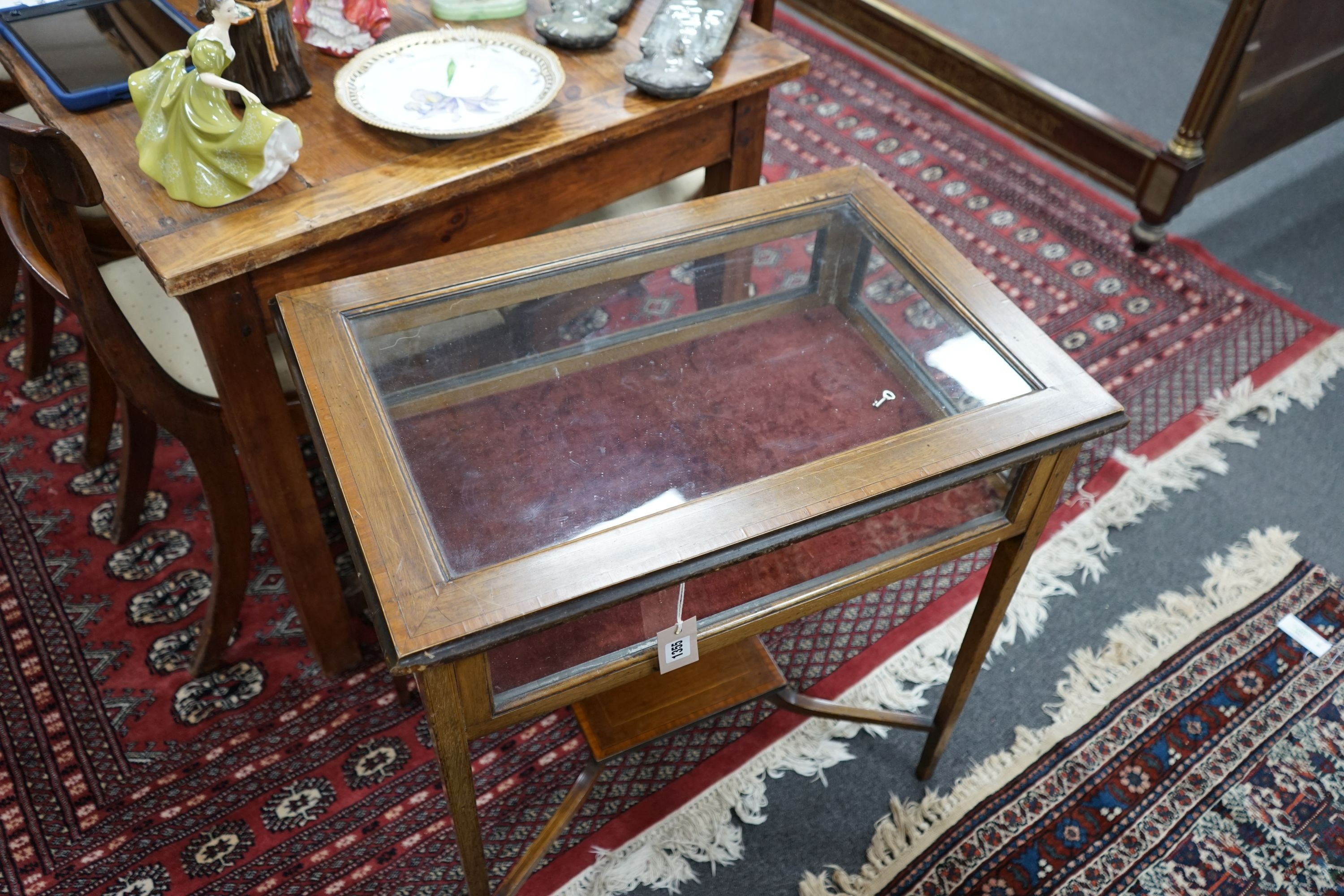 An Edwardian satinwood banded mahogany bijouterie table with under tier, width 65cm, depth 44cm, height 69cm